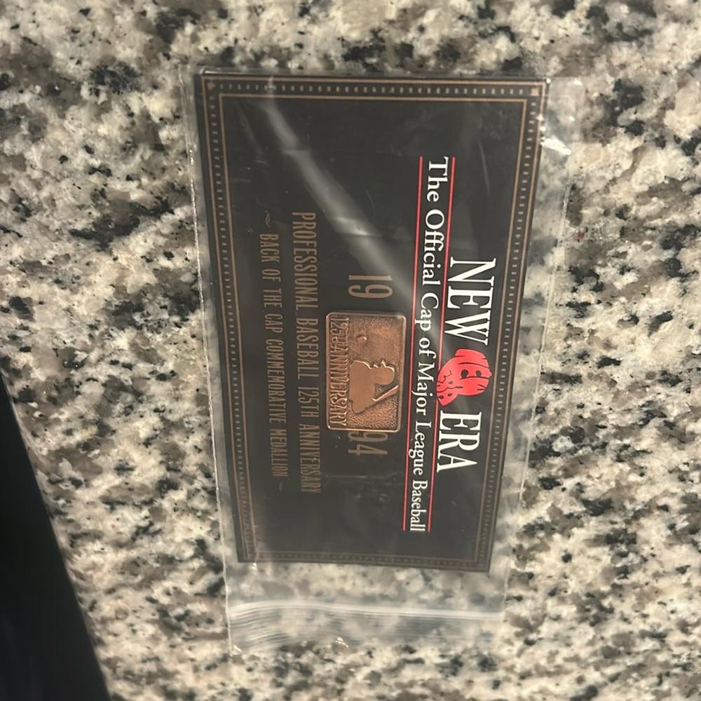 A new, 1994 New Era Major League Baseball hat-pin
